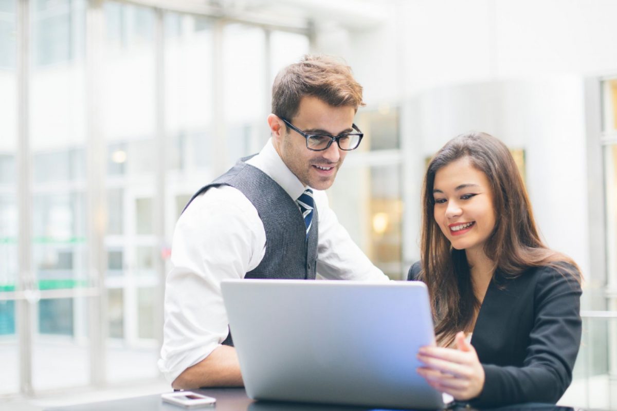 International investors discussing US real estate bridging loan financing with advisor