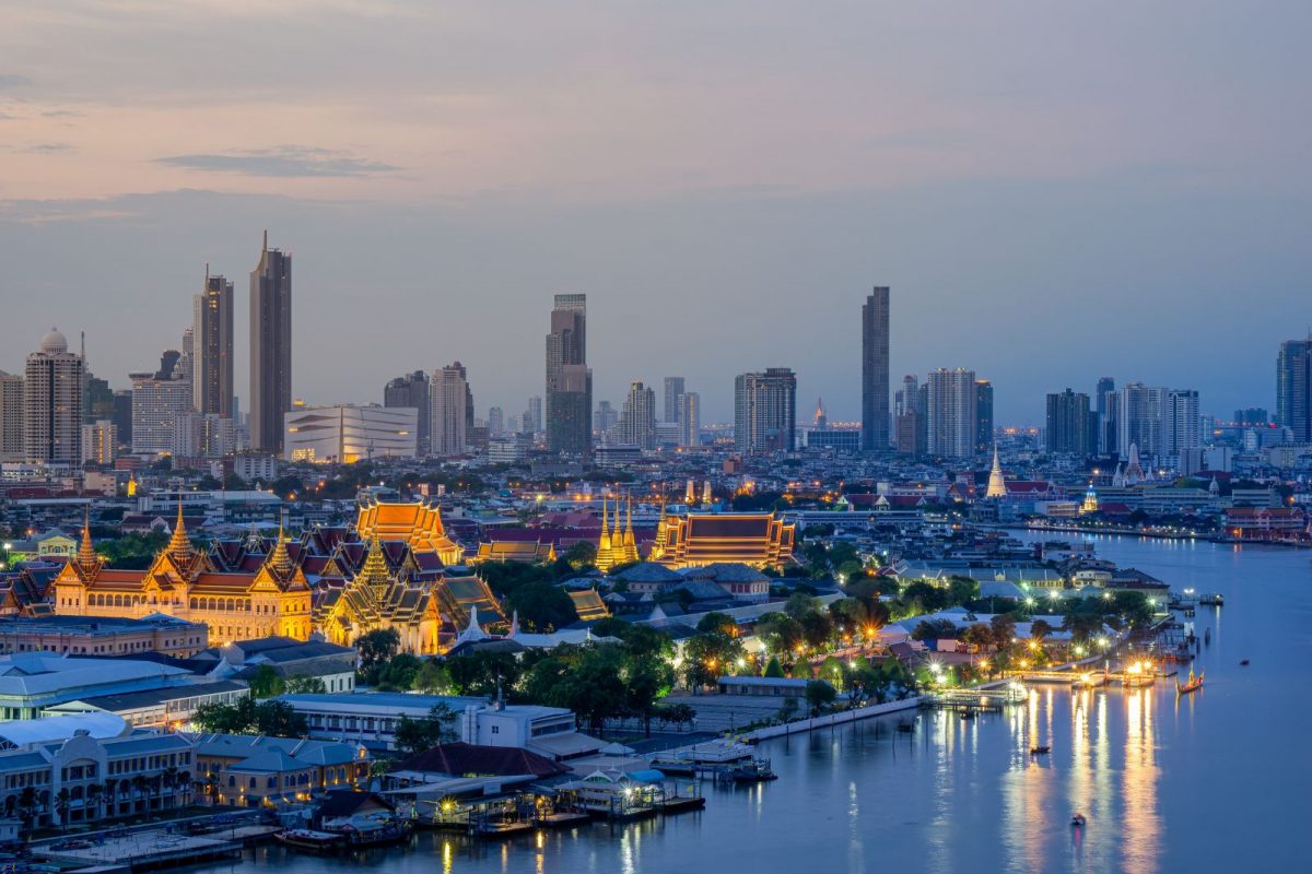 Bangkok skyline at dusk overlooking the Chao Phraya River, symbolizing rising Thailand property values and unlocking equity from high-value real estate without selling.