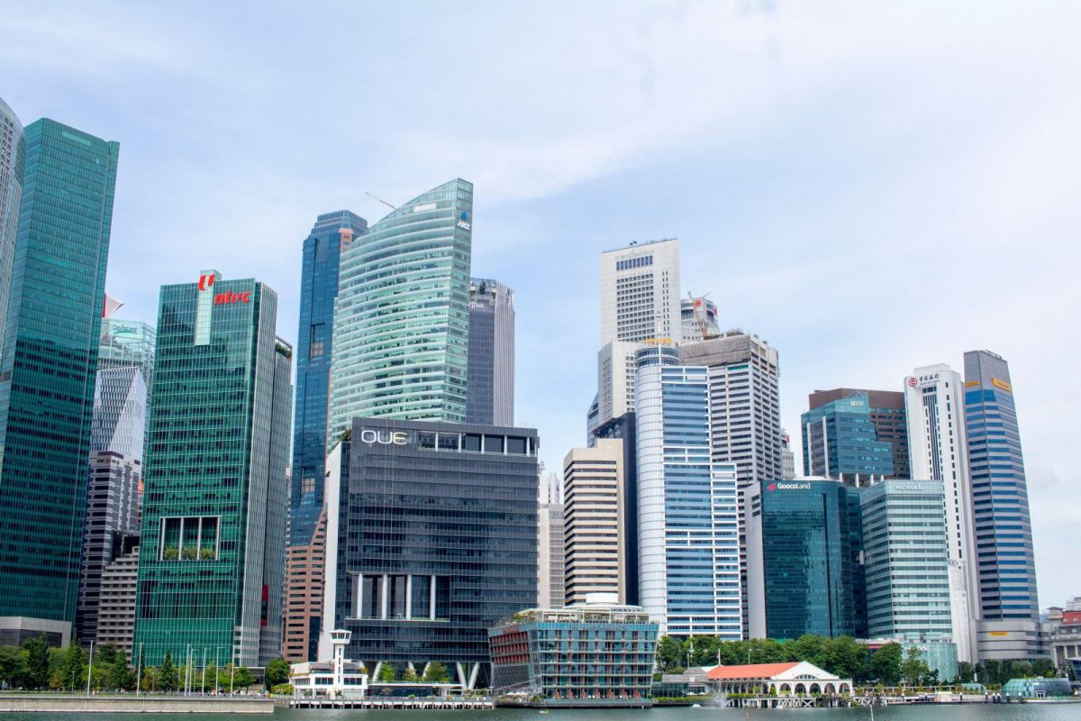 Corporate executives negotiating an acquisition while arranging private credit financing for a cross-border business purchase in Asia Pacific.