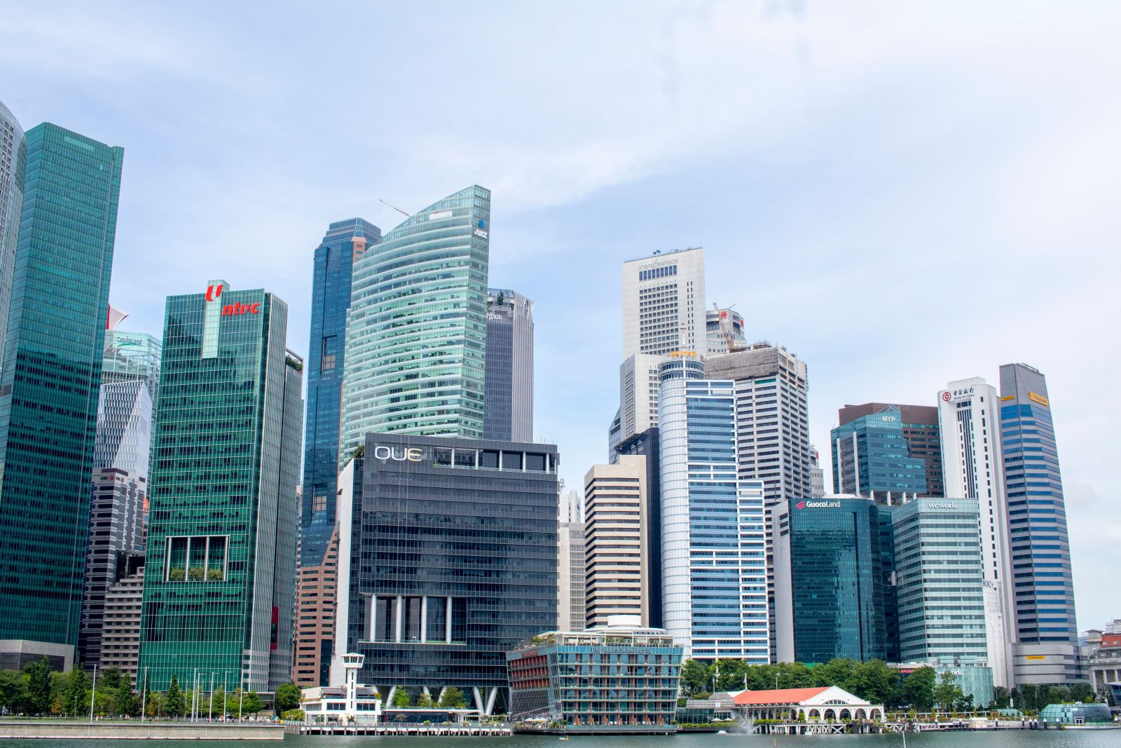Corporate executives negotiating an acquisition while arranging private credit financing for a cross-border business purchase in Asia Pacific.